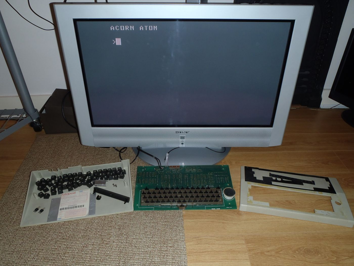 A vintage home computer connected to a monitor
